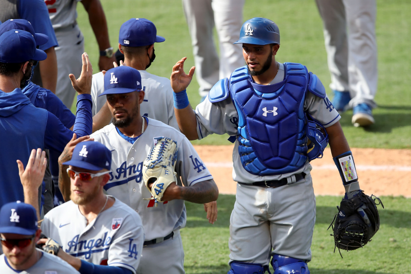 Dodgers catcher Keibert Ruiz celebrates with teammates after a win over the Angels in August.