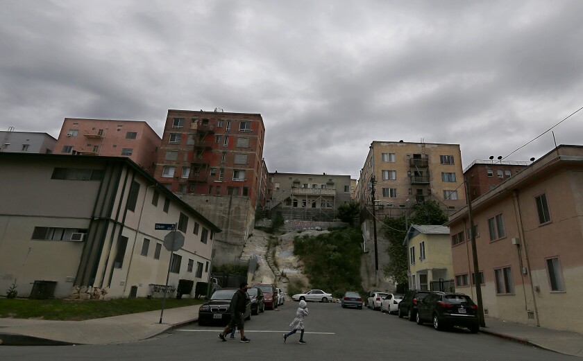 People walk along Union Avenue in the Westlake District of Los Angeles, which has the second highest population density in the city, with about 38,214 people per square mile.