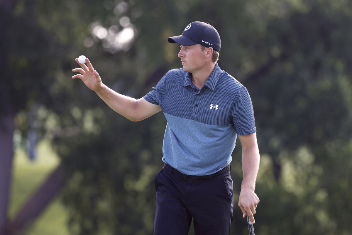 Jordan Spieth acknowledges the gallery on the 18th green in Fort Worth on May 29, 2021.