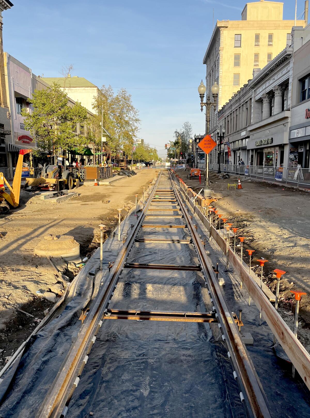 Track is laid as OC Streetcar construction continues along 4th Street in downtown Santa Ana. 