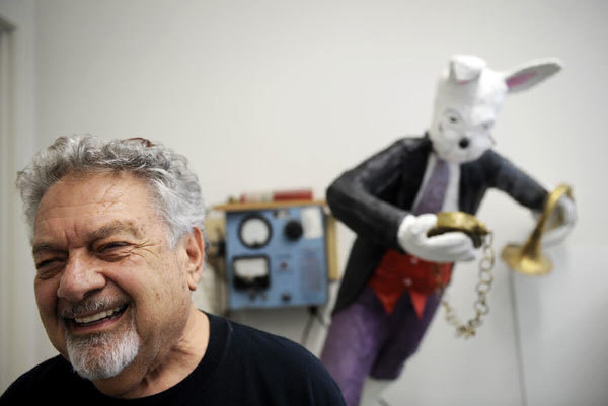 PRIDE OF PLACE: Gene Schklair studies with one of his artworks in his residence at the Burbank Senior Artists Colony. The facility, he says, helps seniors "come alive."