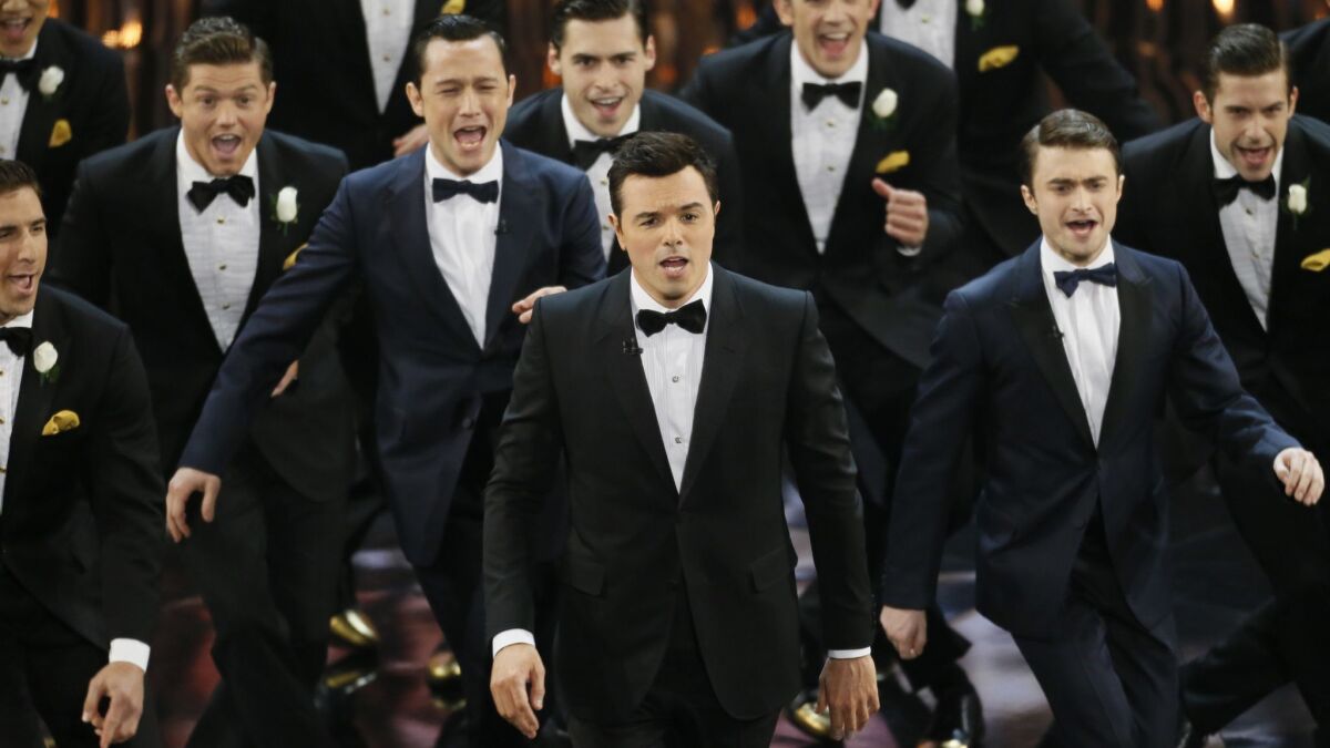 Seth MacFarlane, center, garnered laughs and some criticism as host of the 85th Academy Awards in 2013.