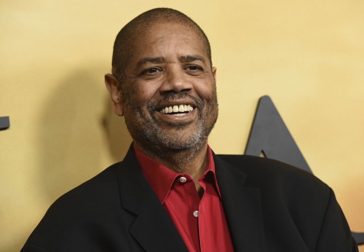 FILE - Gregory Allen Howard arrives at the Los Angeles premiere of "Harriet" on Oct. 29, 2019. Howard, who skillfully adapted stories of historical Black figures in “Remember the Titans” starring Denzel Washington, “Ali” with Will Smith and “Harriet” with Cynthia Erivo, died Friday at a hospital in Miami of heart failure, according to publicist Jeff Sanderson. He was 70. (Photo by Chris Pizzello/Invision/AP, File)