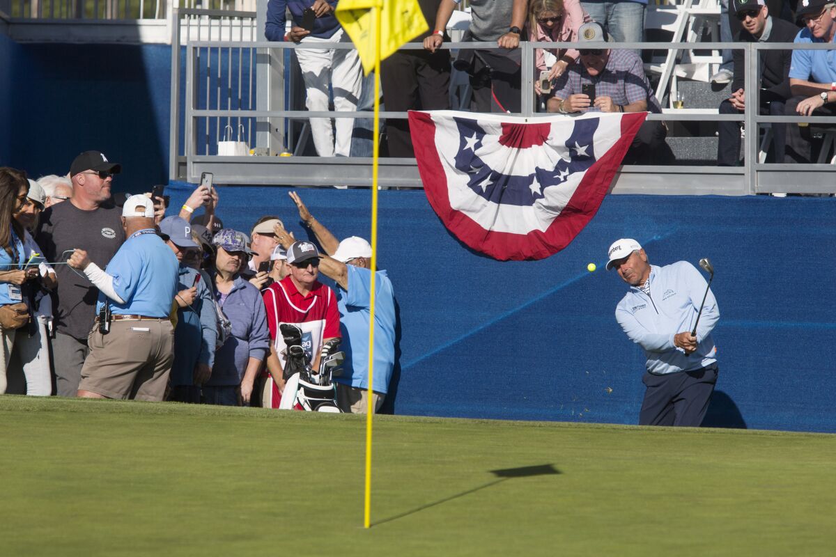 Fred Couples of Newport Beach chips the ball onto the green of the 18th hole during the Hoag Classic in 2020.