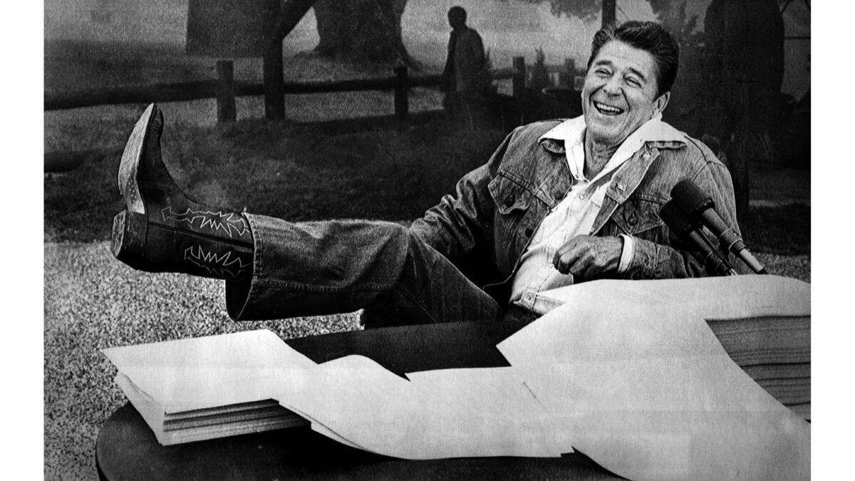 Aug. 13, 1981: During a press conference, President Reagan shows his boot following questions regarding a bubonic plague threat near his Santa Barbara ranch.