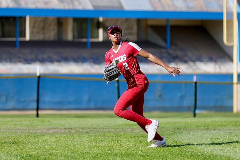 Orange Lutheran center fielder Kai Minor track a fly ball.