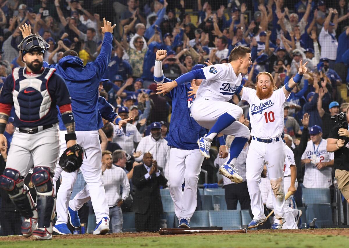 The Dodgers celebrate Max Muncy's walk-off home run against the Boston Red Sox in the bottom of the 18th inning in Game 3 of the World Series.