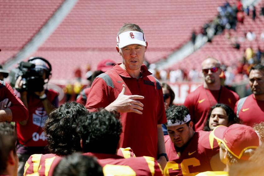 LOS ANGELES, CA - APRIL 23: Head coach Lincoln Riley talks to the players at the end of the USC Football Spring Game at the Los Angeles Memorial Coliseum on Saturday, April 23, 2022 in Los Angeles, CA. (Gary Coronado / Los Angeles Times)
