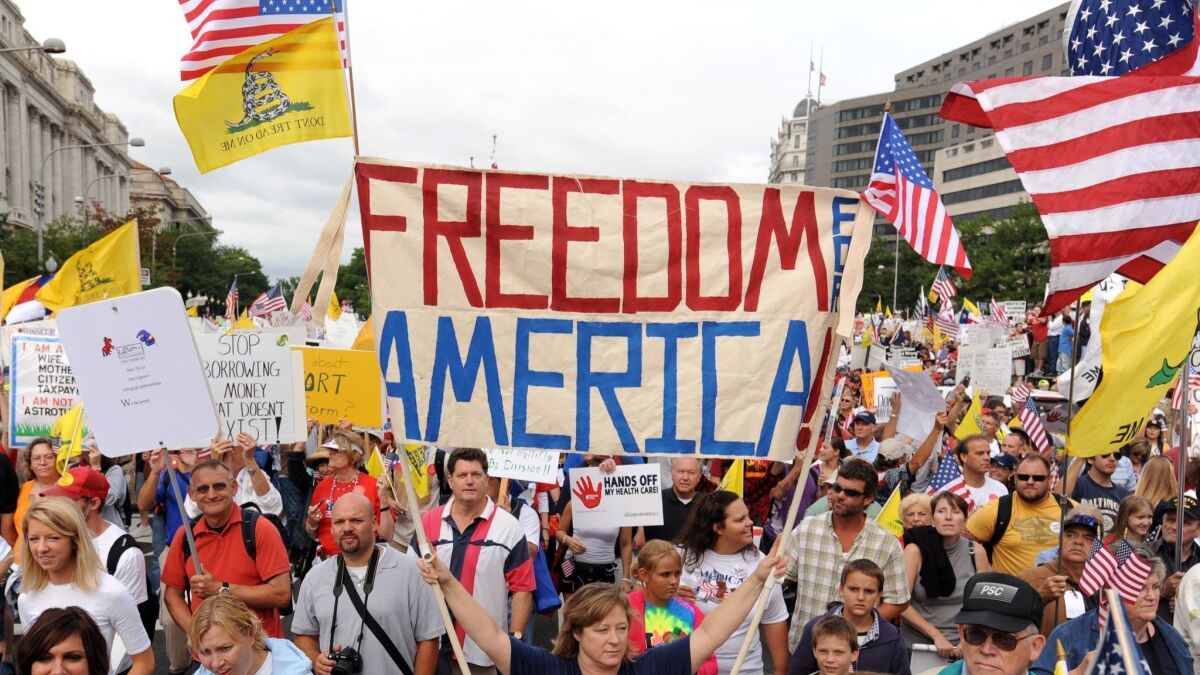 Thousands of people march in Washington, D.C., during a tea party demonstration in 2009.