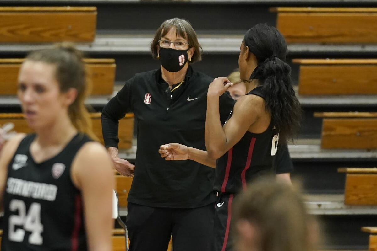Stanford head coach Tara VanDerveer talks with Stanford guard Kiana Williams.