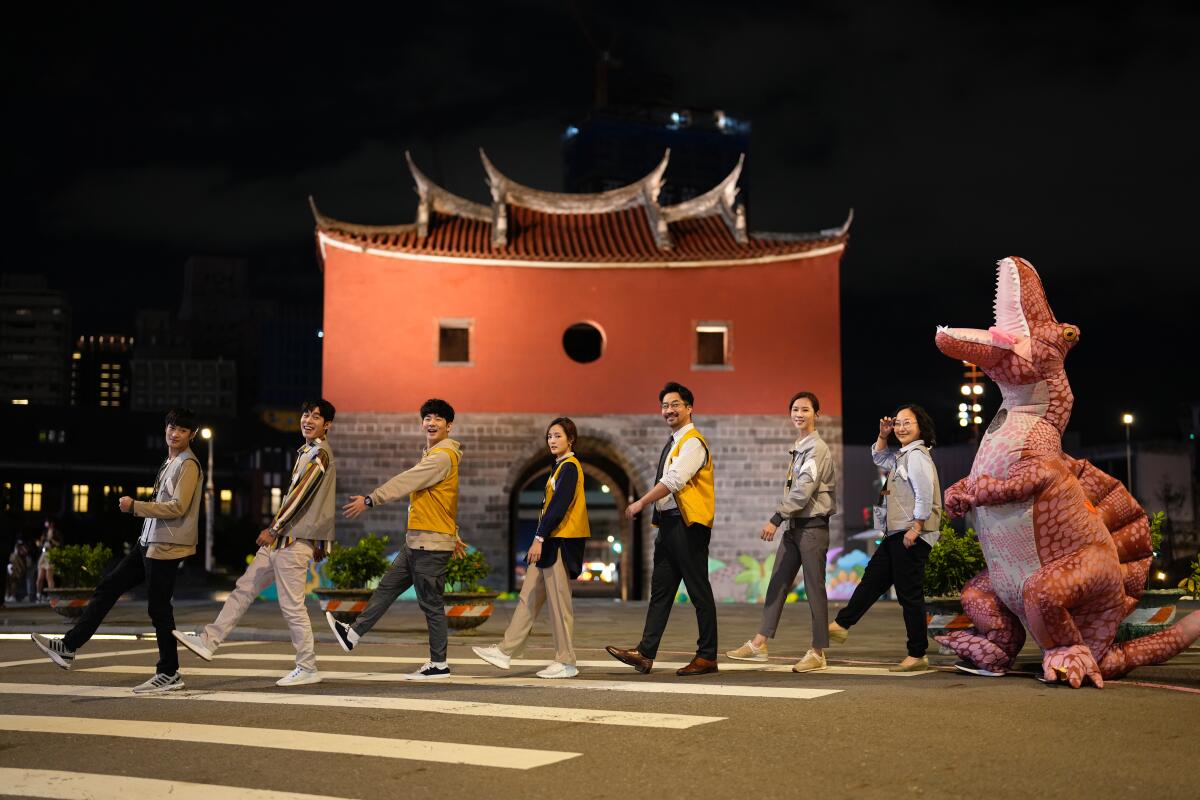 People crossing a street in a scene from the Taiwanese Netflix show "Wave Makers"