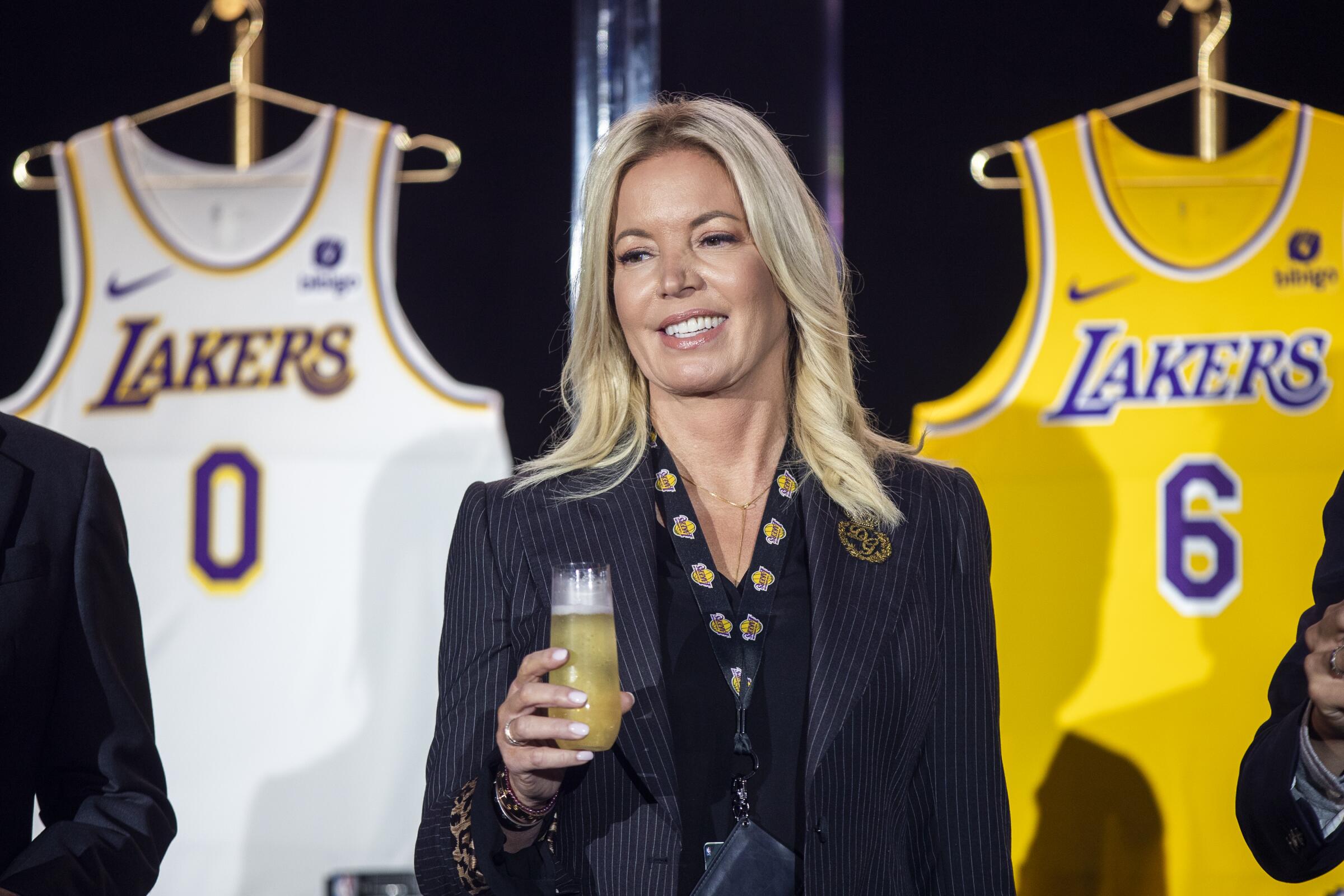 Lakers owner Jeanie Buss holds a new team jersey ahead of the 2021-2022 season 