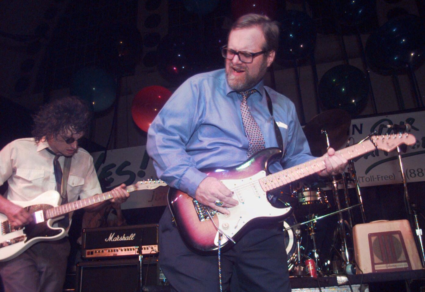 Paul Allen, right, jams with the Beatniks' Bobby Beaulieu on June 18, 1997, after an election night watch party in Seattle.