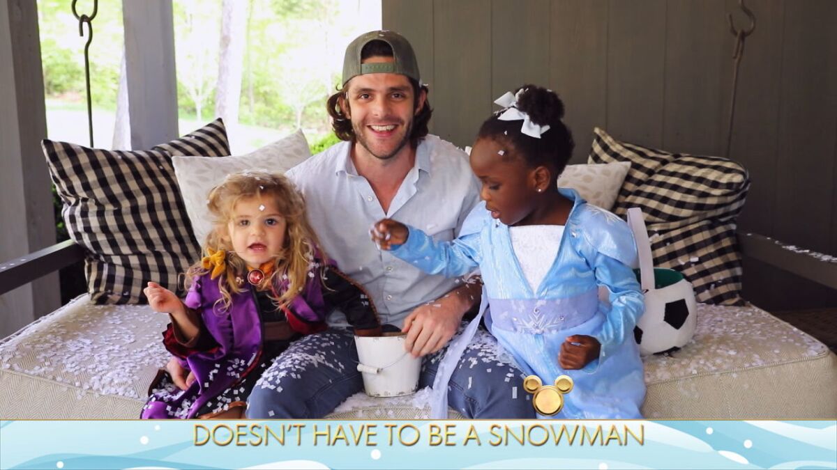 Country singer Thomas Rhett with daughters Ada, left, and Willa on the "Disney Family Singalong."