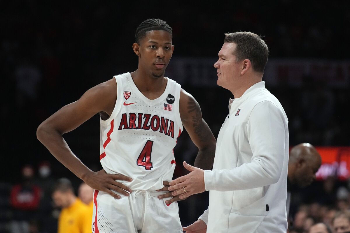 Arizona coach Tommy Lloyd talks to guard Dalen Terry during a game against Northern Colorado in December.