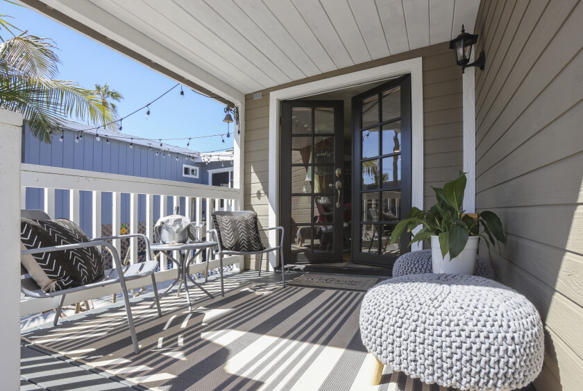 The porch and entrance feature UV-resistant furnishings.