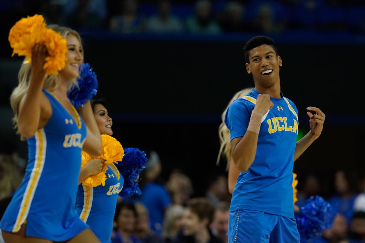 Devin Mallory performs with the UCLA Spirit Squad Dance Team during a NCAA basketball game between the UCLA Bruins and the Long Beach State 49ers.