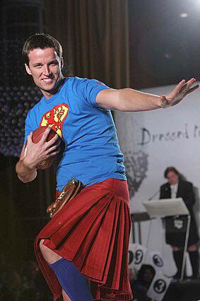 New York Giants' Lawrence Tynes, who was born in Scotland, walks the runway at the Dressed To Kilt and Friends of Scotland charity fashion show.