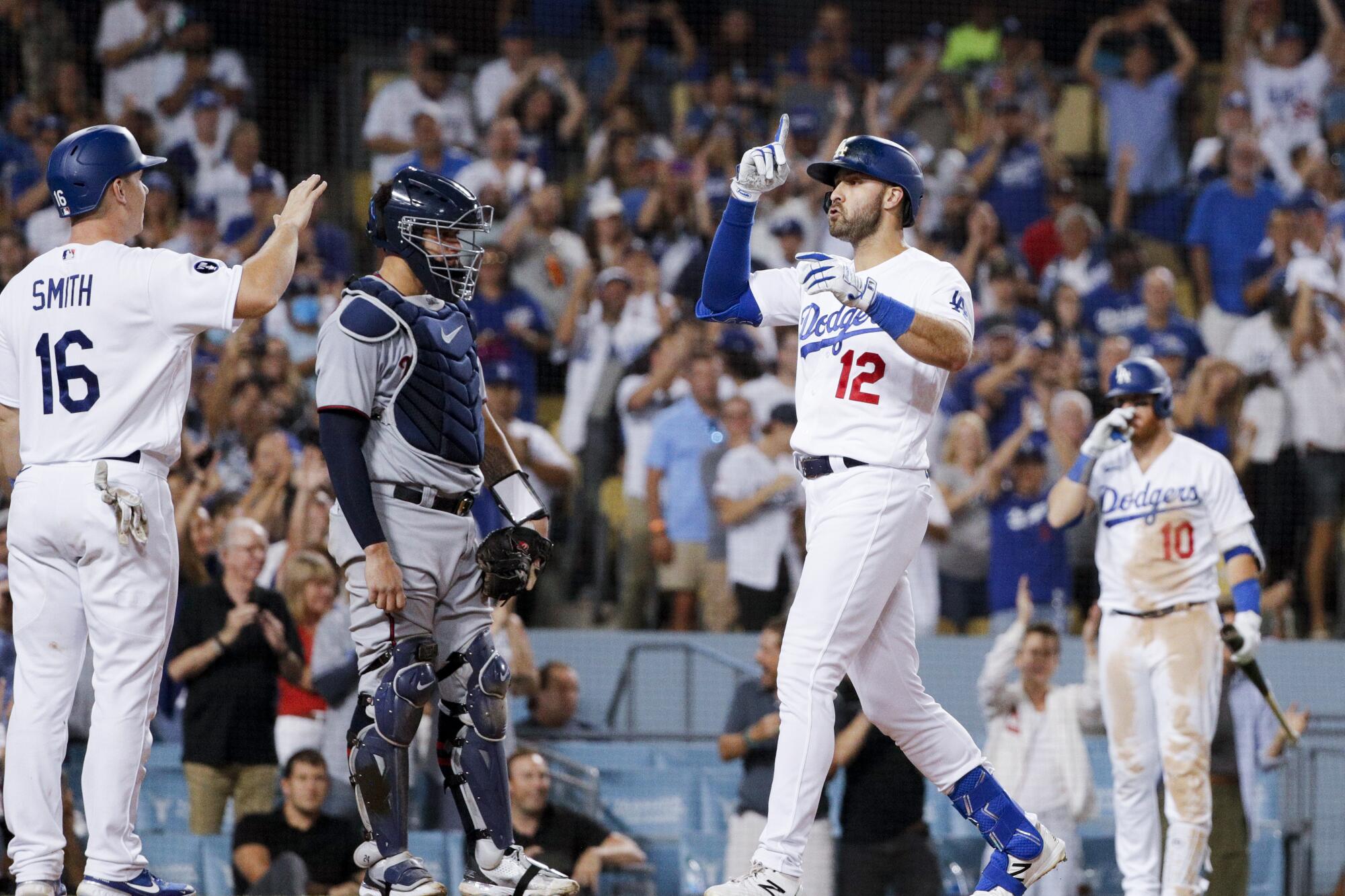 Joey Gallo, right, celebrates while crossing home after hitting a three-run home run.