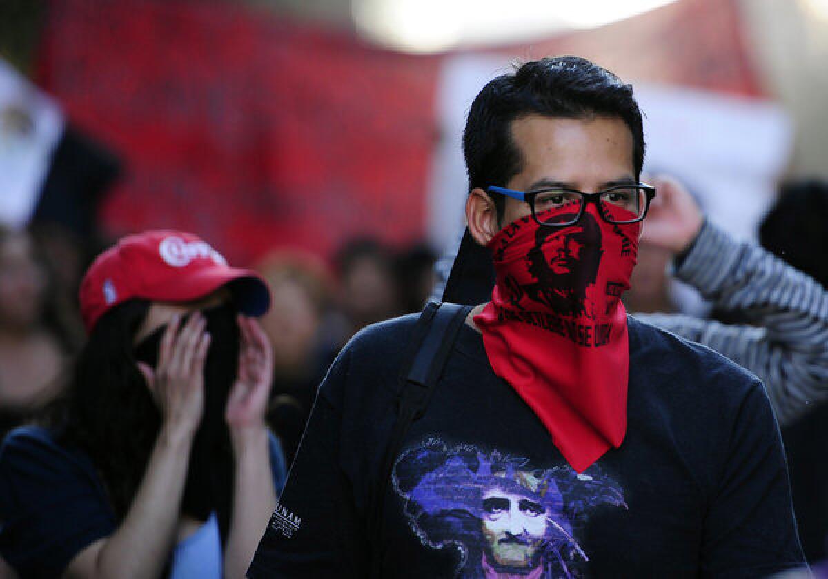 Protesters in Mexico City on Monday demand the release of demonstrators who were detained during the presidential inauguration last week.