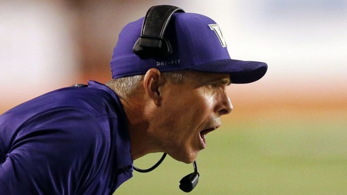 Coach Chris Petersen has guided Washington to a 10-3 record and the Pac-12 title this season.