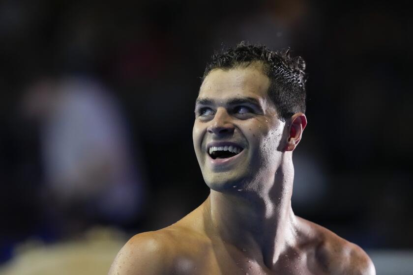 Michael Andrew reacts after winning the Men's 100 Breaststroke during wave 2 of the U.S. Olympic Swim Trials on Monday, June 14, 2021, in Omaha, Neb. (AP Photo/Charlie Neibergall)