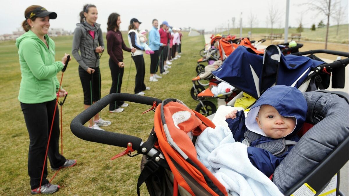 A group of moms meets up with their babies to exercise together. Getting regular exercise is one of five healthy habits associated with a reduced risk of obesity in the next generation.