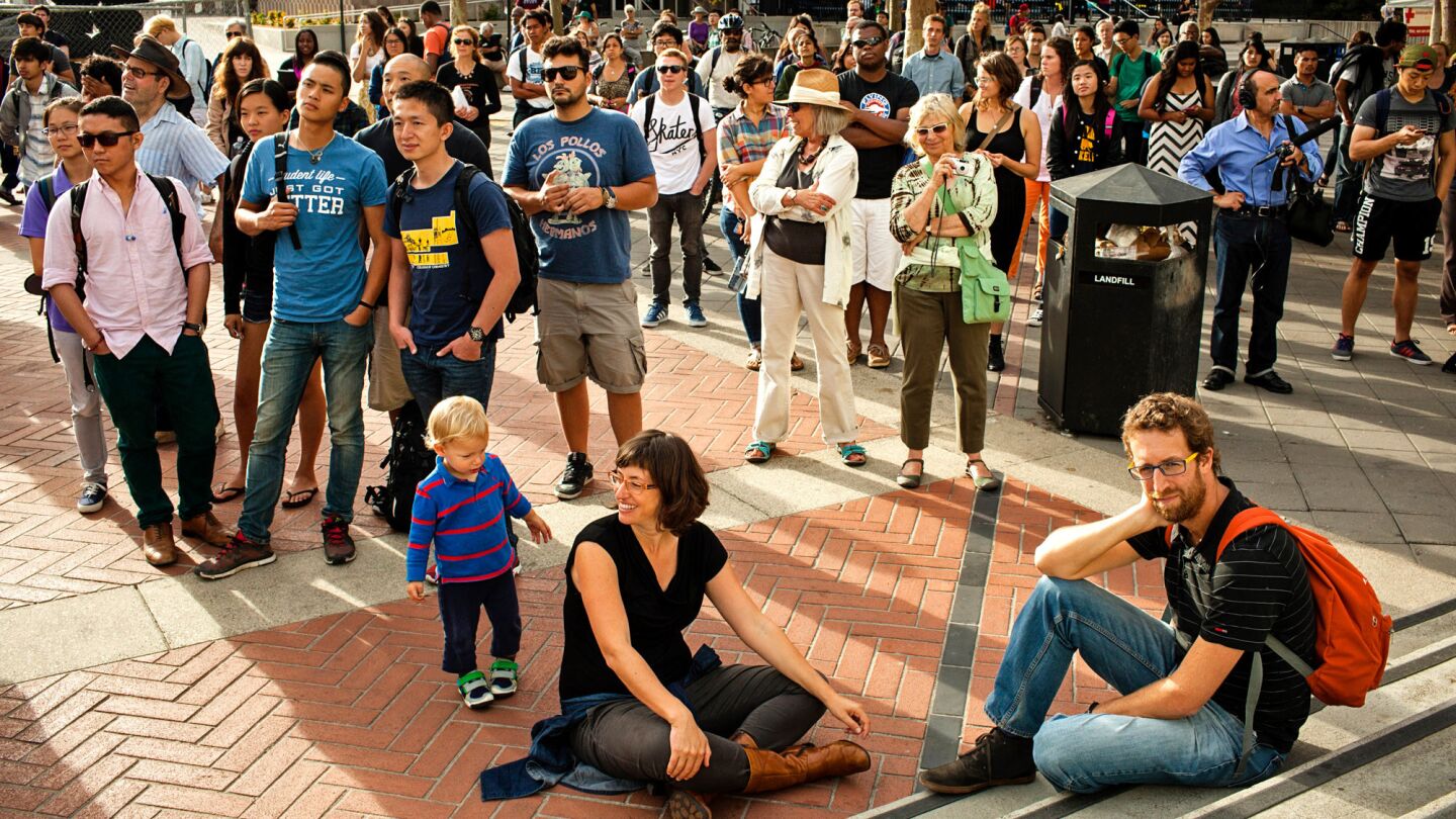 Spectators gather for a singalong to honor the 50th anniversary of the Free Speech Movement on the UC Berkeley campus Tuesday.