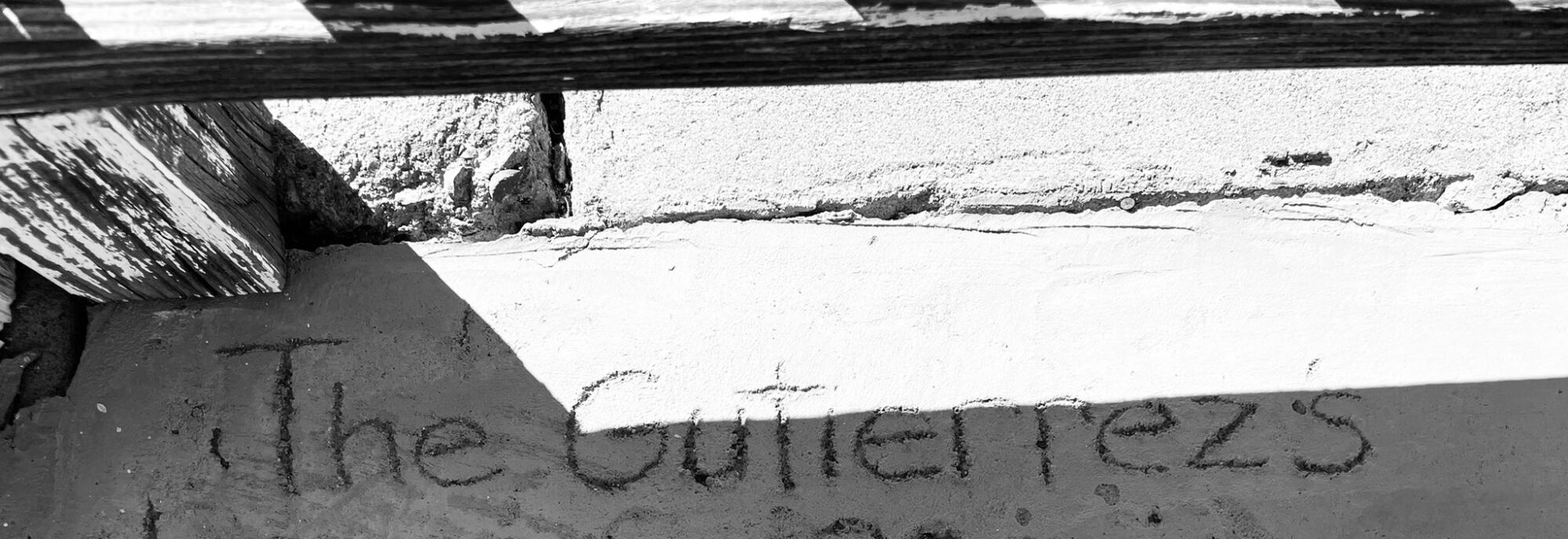 The words "The Gutierrez's" written in cement.