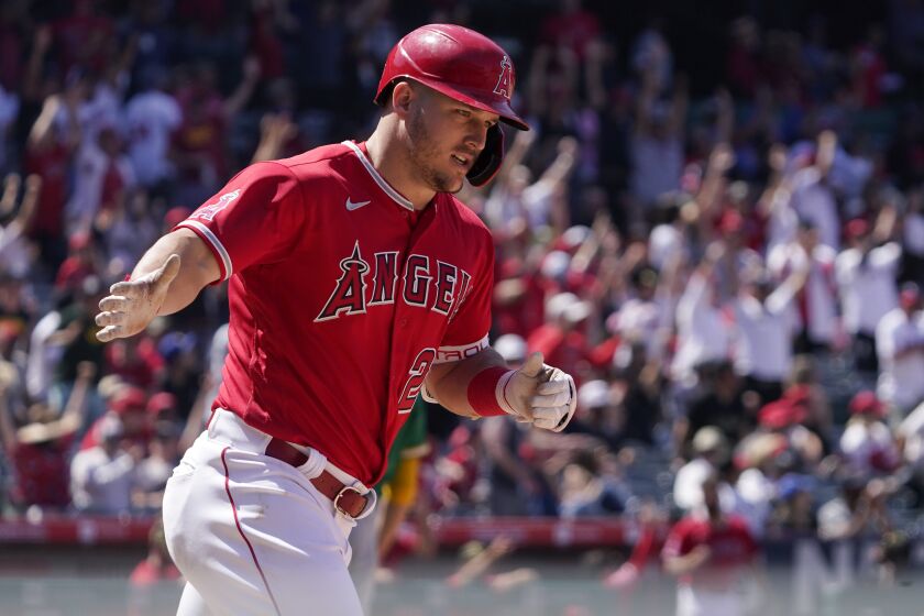 Los Angeles Angels' Mike Trout rounds first after hitting a solo home run