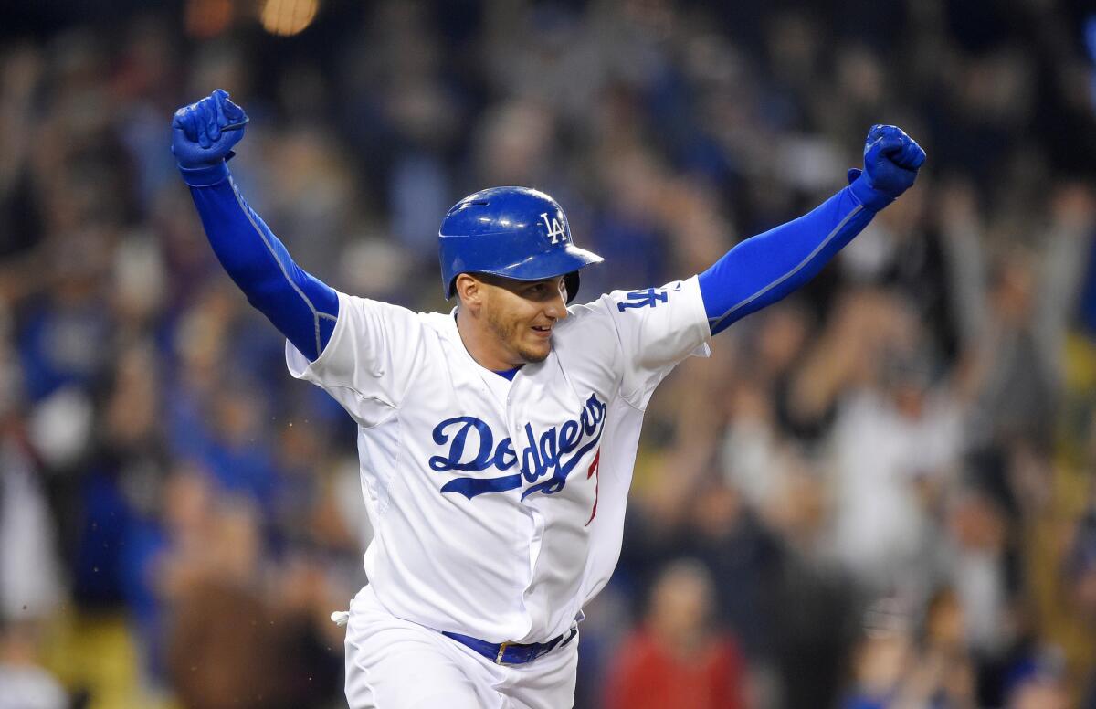 Dodgers infielder Alex Guerrero celebrates his walk-off, game-winning single in the 10th inning. The Dodgers won 6-5.