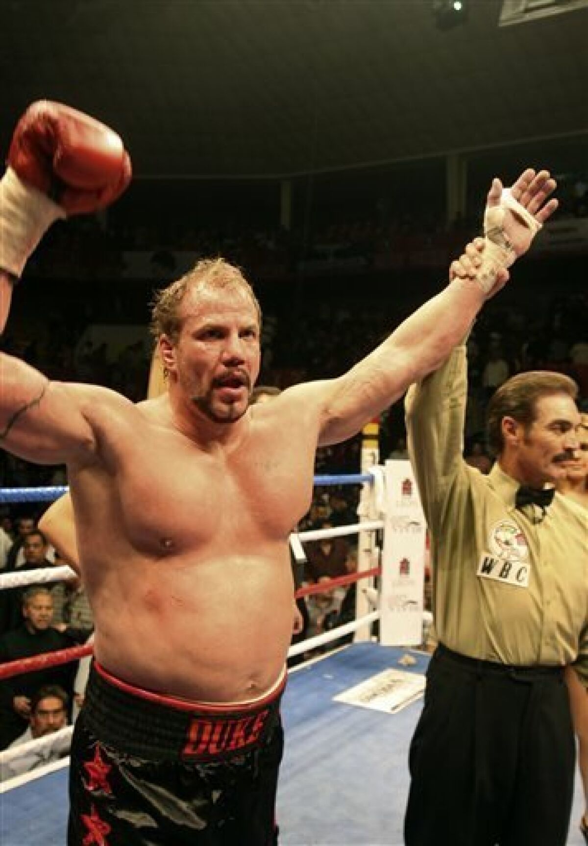 FILEm- In this Feb. 9, 2008 file photo, former world heavyweight champion Tommy Morrison, celebates after defeating Matt Weishaar in Leon, Mexico. Morrison, who gained fame for his role in the movie "Rocky V," has died. He was 44. Morrison's former manager, Tony Holden says his longtime friend died Sunday night, Sept. 1, 2013, at a Nebraska hospital. (AP Photo/Mario Armas)