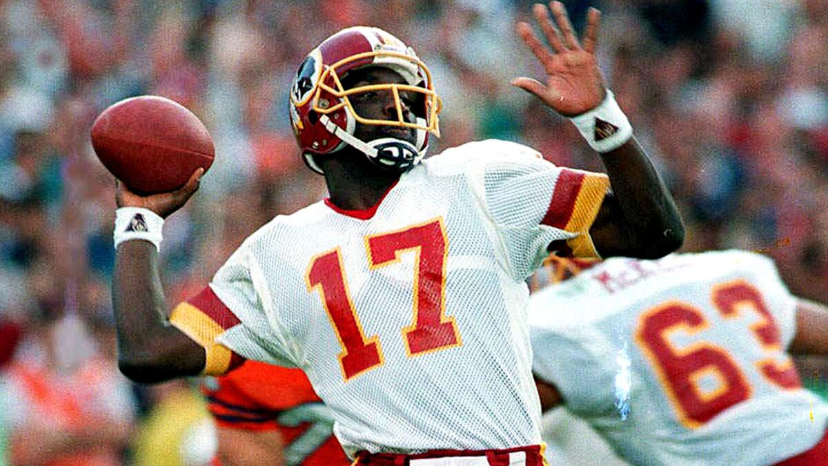 Redskins quarterback Doug Williams unleashes a pass against the Broncos during first quarter of Super Bowl XXII.on Jan. 31, 1988.