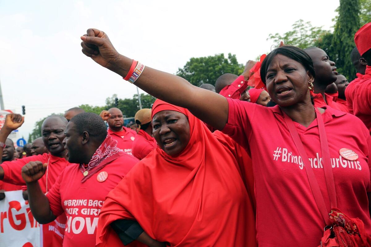 Members of the Bring Back Our Girls group campaigning for the release of the Chibok schoolgirls kidnapped by Boko Haram militants march to meet with the Nigerian president in Abuja on July 8.