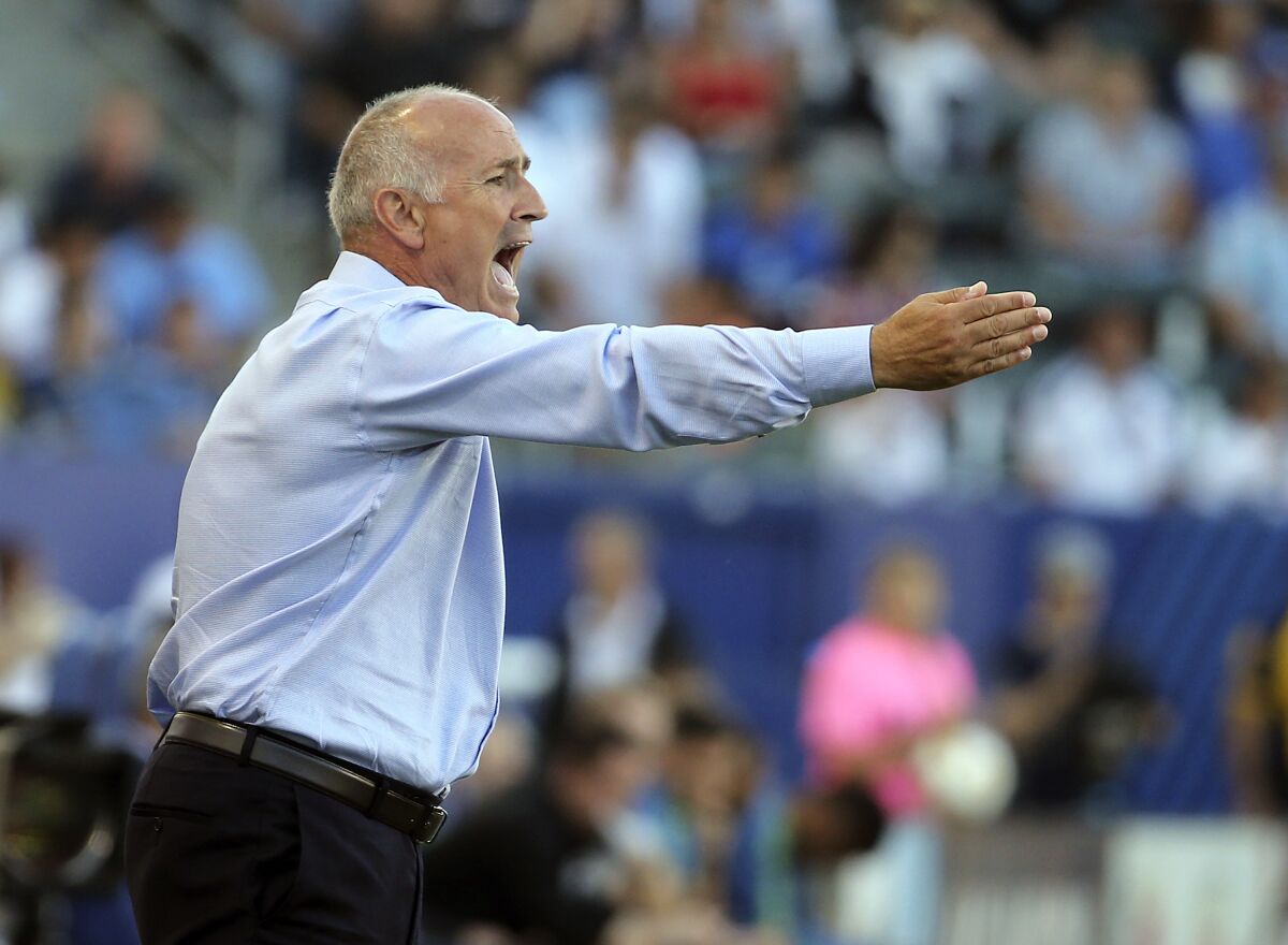 Dominic Kinnear shouts from the sideline while coaching for the Galaxy on Sept. 23, 2018, against Seattle.