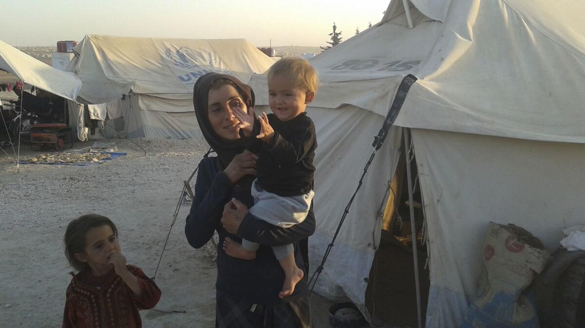 Watha Haider can't afford to rebuild her destroyed home in Raqqah, Syria. Her family spent all its savings on a motorcycle to flee the city when it was under bombardment. So she and her four children are living in a tent at Ain Issa for the winter.