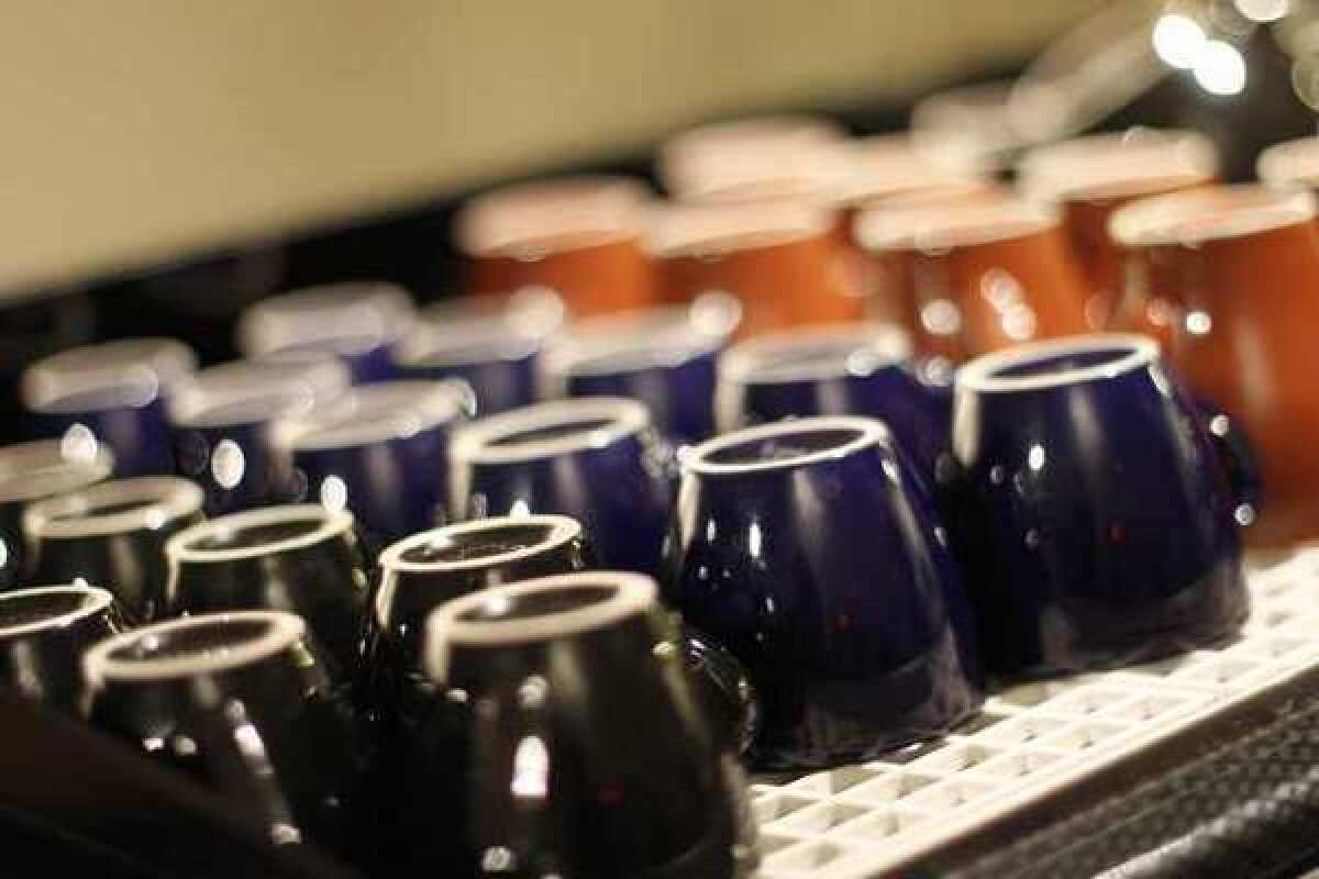 Cups lined up at Cafecito Organico on Heliotrope Drive. The local roaster is offering tasting classes at three locations.