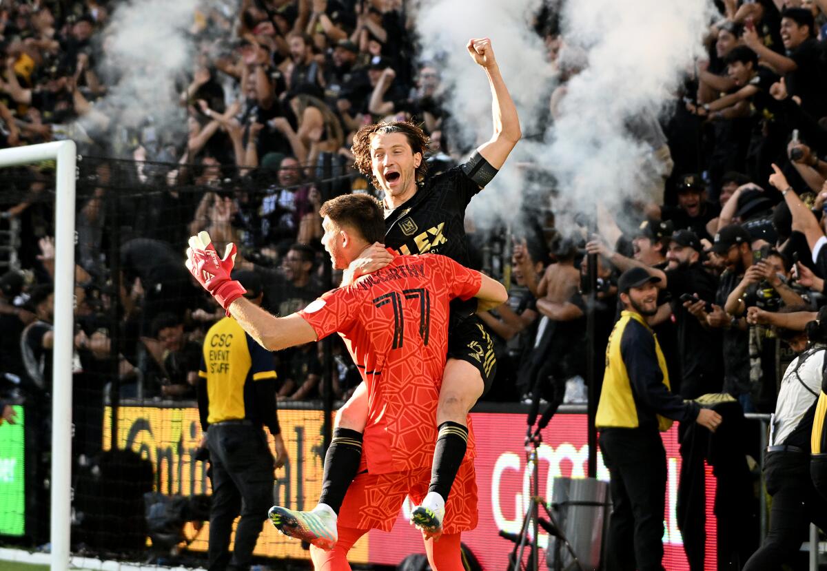 LAFC goalie John McCarthy and Ilie Sanchez celebrate winning the MLS Cup 