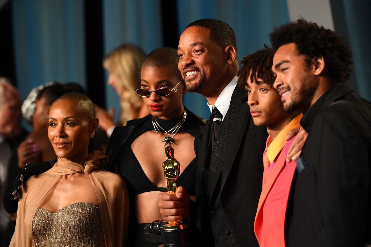 Will Smith, center, attends the 2022 Vanity Fair Oscars after-party with his family.