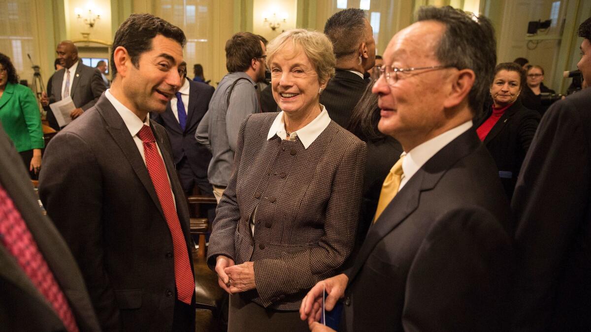 California Supreme Court Justice Mariano-Florentino Cuellar, left, with former Justice Kathryn Werdegar and Justice Ming Chin at Gov. Jerry Brown's State of the State speech on Jan. 21, 2016.