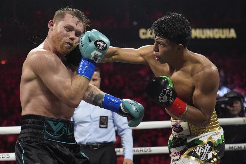 Jaime Munguia hits Canelo Alvarez in a super middleweight title fight Saturday, May 4, 2024, in Las Vegas. (AP Photo/John Locher)