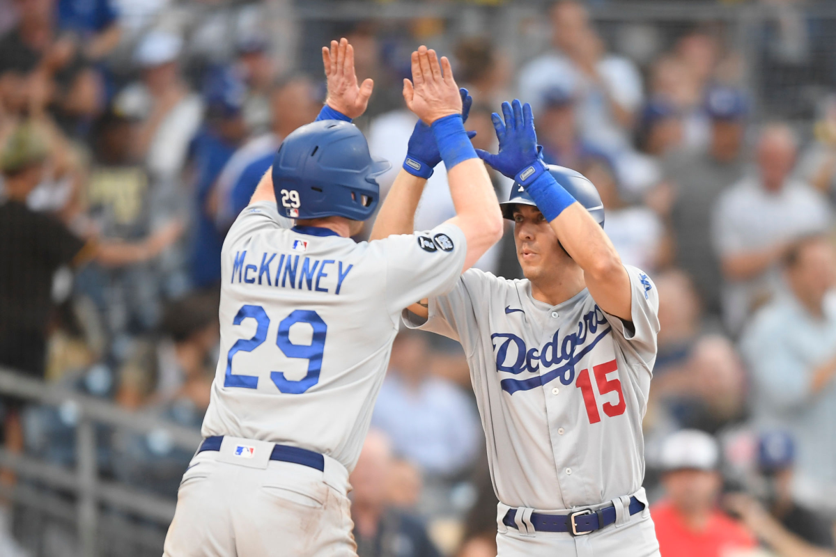 Austin Barnes, right, is congratulated by Dodgers teammate Billy McKinney after hitting a two-run home run.