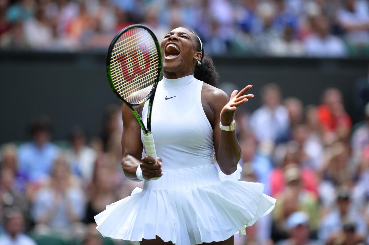 Serena Williams reacts after a point against Switzerland's Amra Sadikovic during their first round match at Wimbledon.
