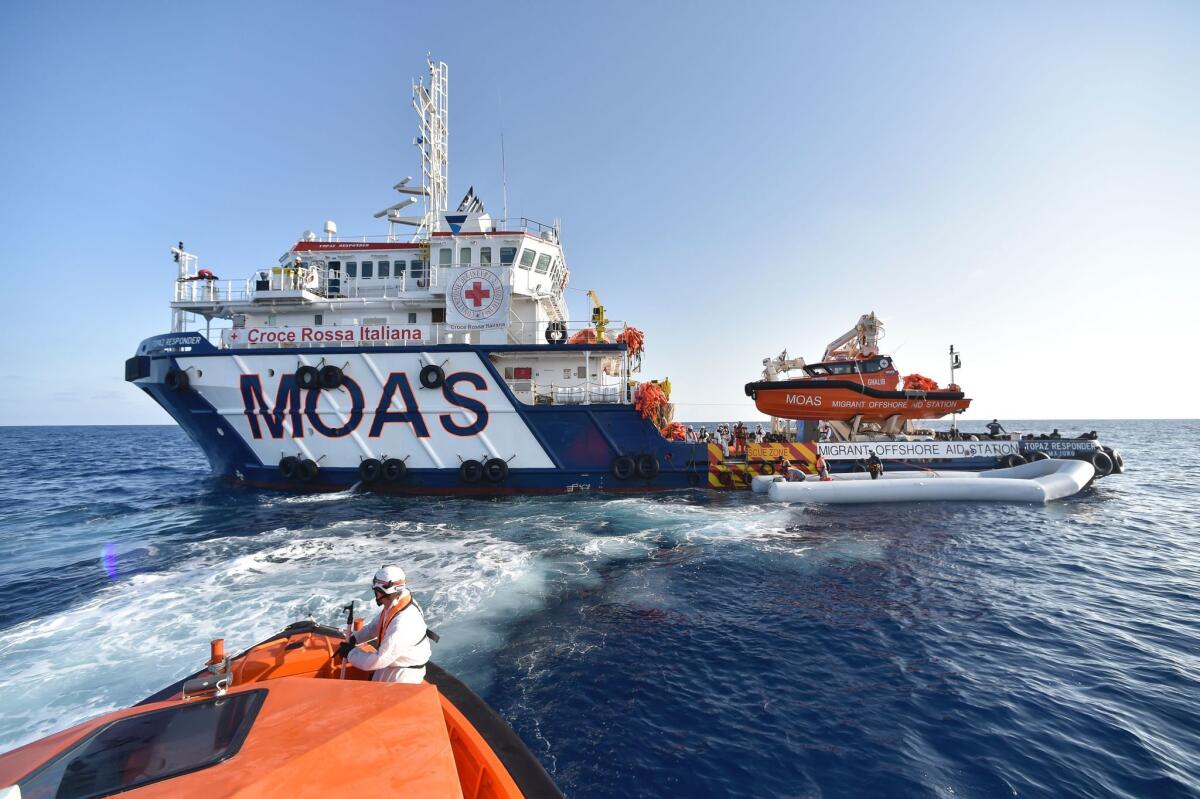 A ship run by the Maltese Migrant Offshore Aid Station and the Italian Red Cross takes part in a Nov. 3 operation to rescue migrants and refugees off the Libyan coast in the Mediterranean Sea.