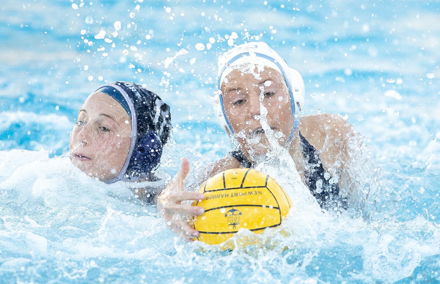 Corona del Mar High's Kira Hoffman, right, battles with Newport Harbor's Taylor Smith for a loose ball during a Surf League match on the road Wednesday.
