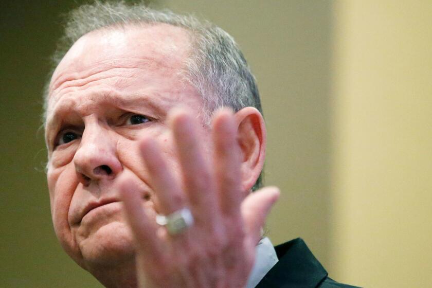 Former Alabama Chief Justice and U.S. Senate candidate Roy Moore speaks at the Vestavia Hills Public library, Saturday, Nov. 11, 2017, in Birmingham, Ala. According to a Thursday, Nov. 9 Washington Post story an Alabama woman said Moore made inappropriate advances and had sexual contact with her when she was 14. Moore has denied the allegations. (AP Photo/Brynn Anderson)