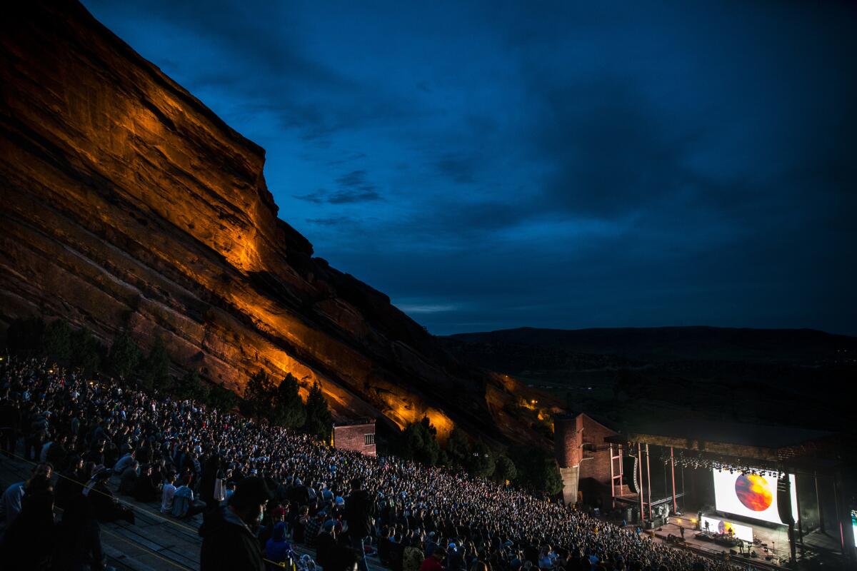 Fans listen as Phantogram/Tycho performs at the Red Rocks Amphitheatre near Denver.