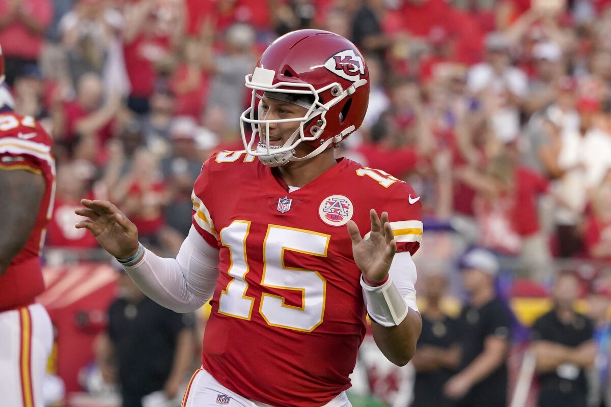 Kansas City Chiefs quarterback Patrick Mahomes celebrates after throwing a touchdown pass during the first half of an NFL football game against the Minnesota Vikings Friday, Aug. 27, 2021, in Kansas City, Mo. (AP Photo/Ed Zurga)