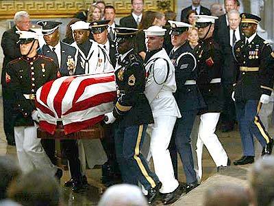 Former President Ronald Reagan's casket is carried into the Capitol Rotunda