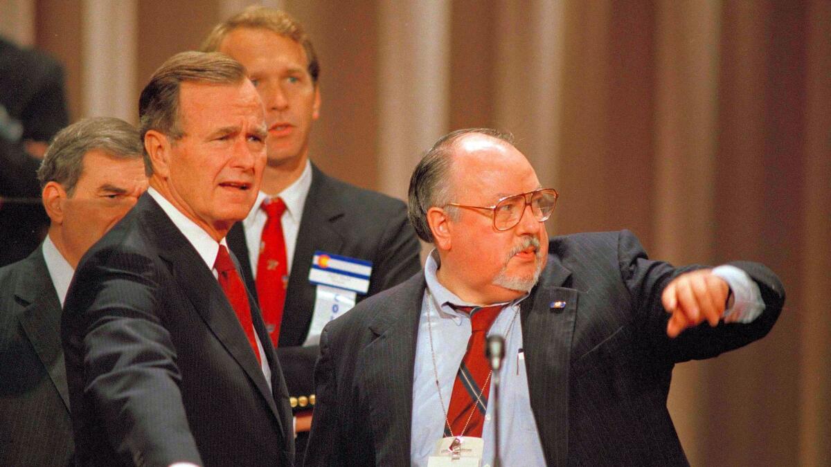 Then-Vice President George H.W. Bush, left, gets some advice from his media advisor, Roger Ailes, prior to the start of the Republican National Convention in New Orleans on Aug. 17, 1988.